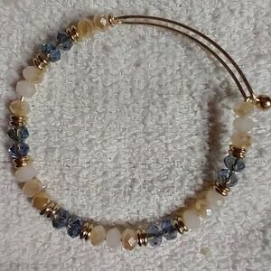 Goldtone wire bracelet adjustable blue yellow faceted beads